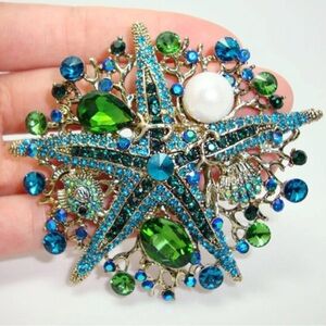 Elegant Starfish Brooch with Blue and Green Crystals